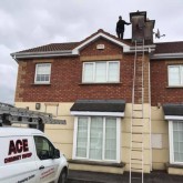Chimney sweep on roof